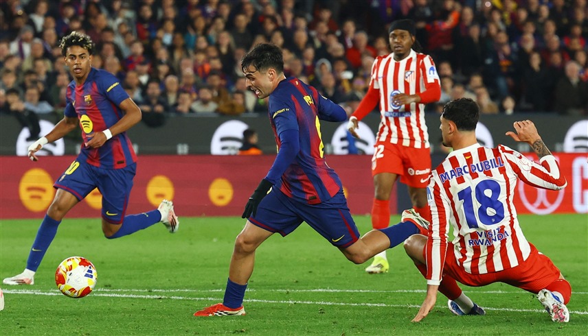 برشلونة وأتلتيكو مدريد (رويترز)