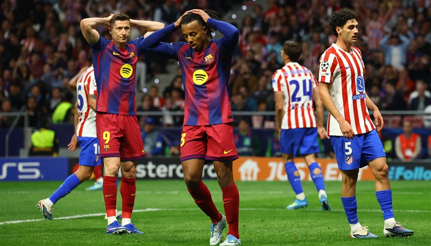 أتلتيكو مدريد وبرشلونة (رويترز) 