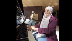 شاهد| مقيمة تعزف النشيد الوطني الإماراتي في مكان عام..  وسط تفاعل الجمهور 
